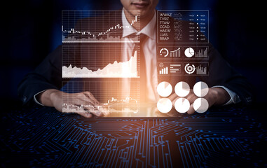 Businessman Analyzing Digital Data Trends on a Futuristic Interface in a Dark Environment for Financial Insights and Predictions Impute.