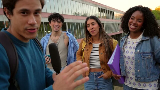 Young student interviewing friends with a microphone at the university campus