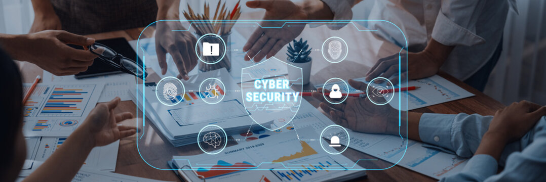 A business meeting focused on cyber security strategy, featuring charts and graphs, emphasizes team collaboration for effective digital protection and risk management. Trope