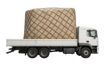 White flatbed truck carrying large cargo, logistics concept