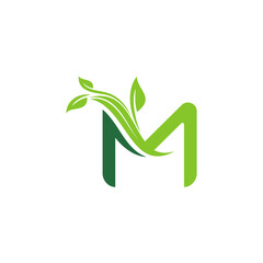 M letter logo vector illustration with green leaf shape decoration