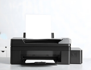 Modern Black Printer in Minimalist Office Setting with Blank Paper