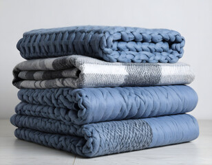 Cozy Blue and Gray Blankets Stacked for Home Comfort and Style