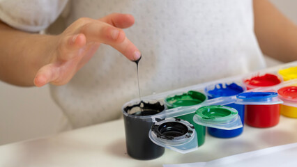 Happy Toddler Girl with Colorful Painted Hands - Creative Mess, Childhood Fun and Art Education Concept