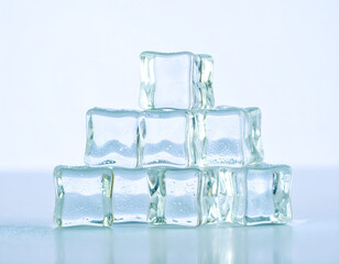 Stack of clear ice cubes on a light background for cooling drinks