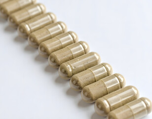 Row of Transparent Capsules Filled with Natural Herbal Powder