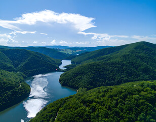 Scenic Aerial View of Serene Lake and Lush Green Mountain Landscape