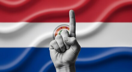 A monochrome hand with the index finger pointing up, symbolizing victory or number one, set against the national flag of Paraguay.