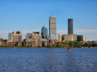 Boston skyline over Charles River with sailboat