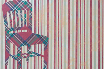 silhouette of a plaid cut paper chair on a lined background