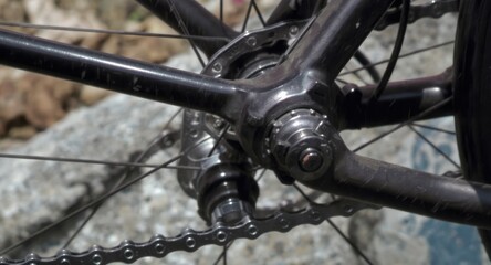 Close-up of bicycle rear derailleur and chain.
