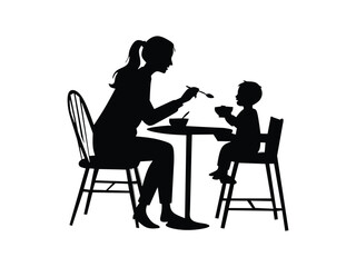 silhouette of a mother feeding her child