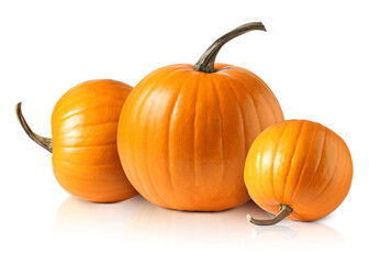 Three fresh orange pumpkins isolated on white
