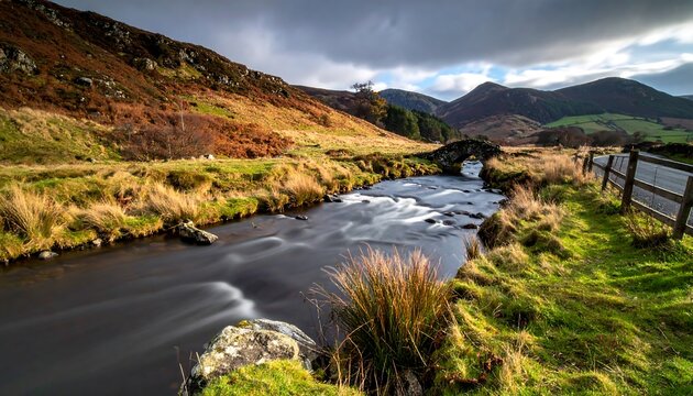 Scenic mountain stream with a bridge