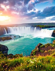 Scenic waterfall at sunset