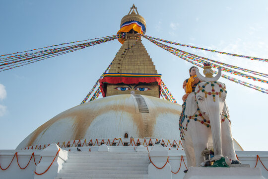 Local art statue in front of Boudhanath stupa the largest stupas in the world located in Kathmandu the capital city of Nepal.