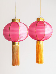 Bright Pink Lanterns with Gold Accents and Long Tassels for Decoration