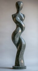 Obraz premium Abstract sculpted female form, dark stone