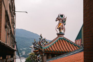 Temple rooftop guardian statue in Taiwan Tamsui