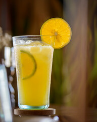 Fresh Orange Juice with Ice and Citrus Slices in Glass