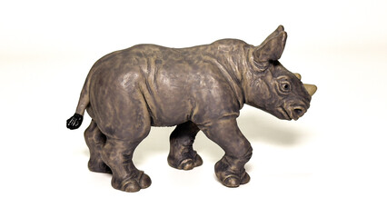 Realistic toy rhinoceros figurine isolated on white background