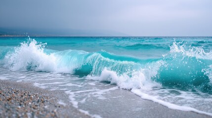 Stormy Turquoise Ocean Waves with Dramatic Sky and Foamy Whitecaps on Sandy Beach