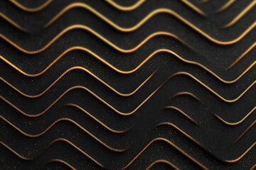 Close-up of undulating black surface with textured golden edges creating a wave pattern and elegant contrast