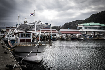Fototapeta premium Resting and fishing boats at Naksan Port