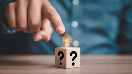 Creative solution represented with a glowing lightbulb on a wooden block revealing an idea concept