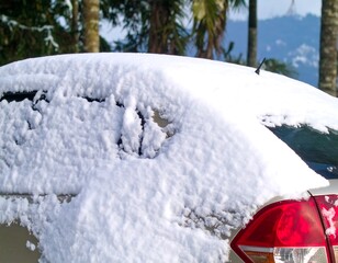 Fototapeta premium Snowy car parked outdoors