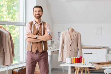 Portrait of male tailor in atelier