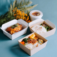 Three takeout lunch boxes with various Asian dishes like glazed chicken and rice, ideal for food delivery.