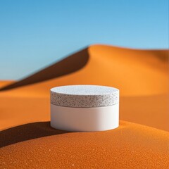 Gray cylinder podium in desert