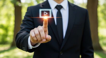 Businessman presses play button on digital screen.
