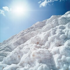 Snowy mountain slope under bright sun
