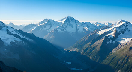 Snow-Capped Mountain Range Under Clear Blue Sky in Scenic Natural Landscape