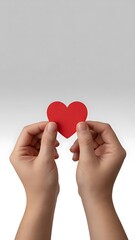 Fototapeta premium Hands holding red heart symbol image