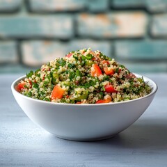 Quinoa salad in white bowl on table