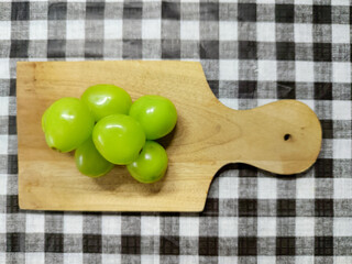 Fresh Green Grapes on a Wooden Board, a Refreshing and Healthy Snack Idea