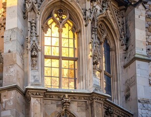 Obraz premium Ornate stone window with golden light