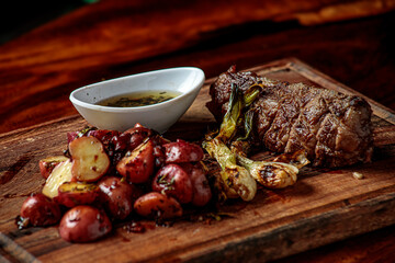 Picaña steak, accompanied by sautéed cambray potatoes and chimichurri