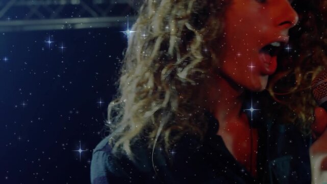 Music singer gripping mic, unleashing notes emotionally with starfield and revealing keyboardist