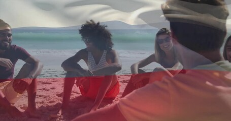 Tourism ad showing friends sitting on beach talking while faint Bulgarian flag overlay waving - Powered by Adobe