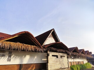 Rustic Traditional Restaurant Building with Thatched Roof Detail Exterior View
