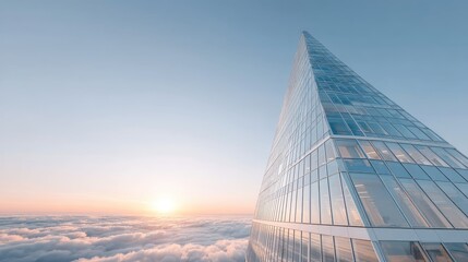 Modern Glass Skyscraper with Reflections Low Angle Against Sky at Sunset, Clouds Below, Geometric Triangular Architecture, Contemporary Building Exterior
