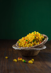 'Sweet bundi' - an Indian traditional sweet served in an eco friendly bowl. Indian stock food photography.