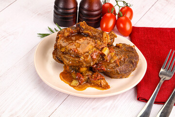 Italian cuisine - ossobuco with sauce