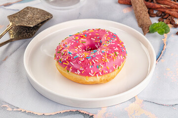 Sweet donut with strawberry icing