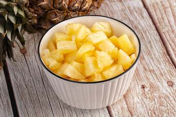 Sweet canned pineapple fruit pieces