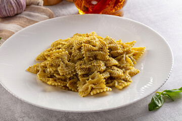 Italian green pasta farfalle with pesto